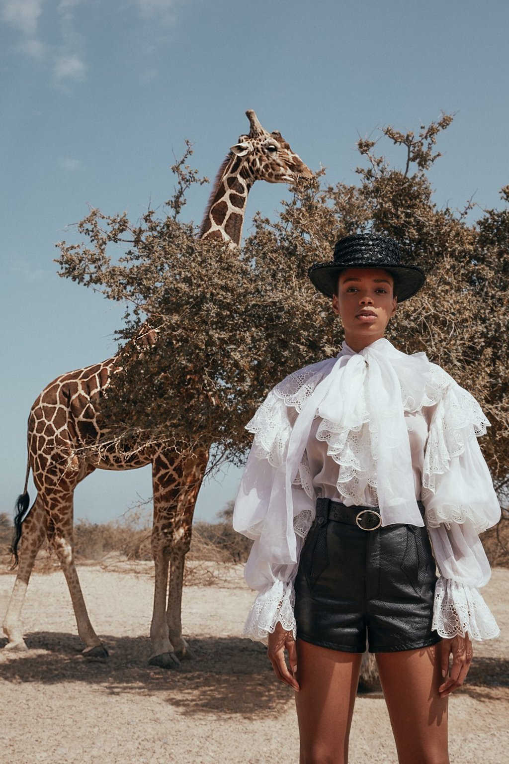 Dolce & Gabanna blouse, price on request; Saint Laurent by Anthony Vaccarello shorts, HK$18,900, belt HK$2,750; Benoit Missolin, hat, HK$3,550