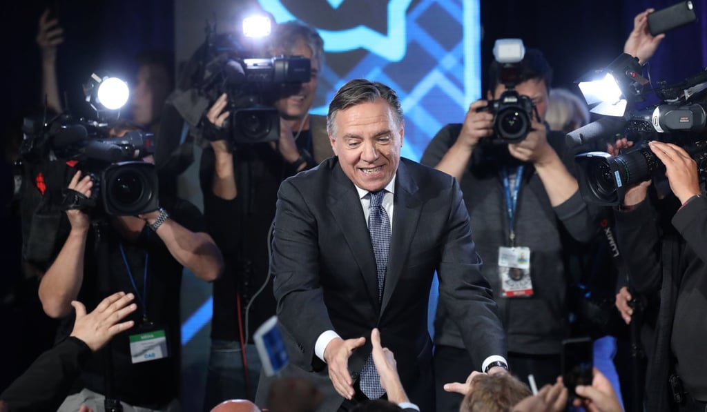 Coalition Avenir Quebec party leader Francois Legault shakes hands with supporters in Quebec City in October. Photo: Reuters