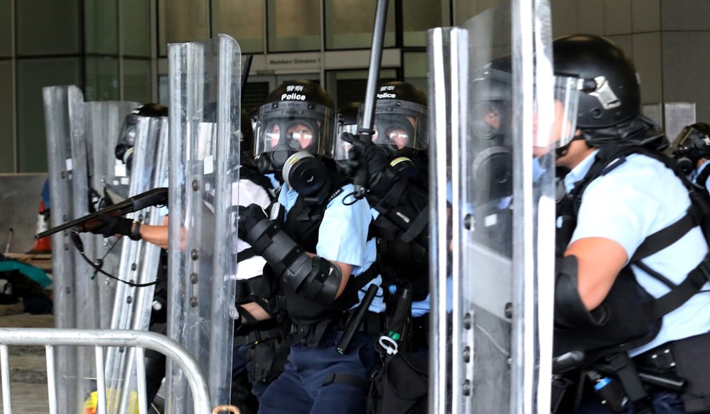 Police officers in anti-riot gear guard Hong Kong’s Legislative Council. Photo: Felix Wong