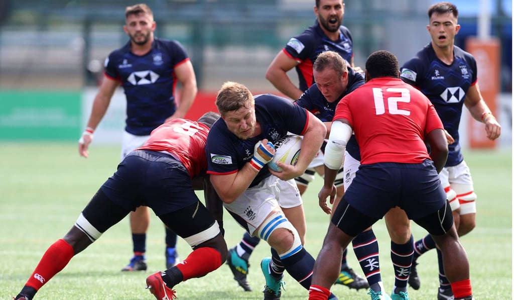 Jack Parfitt breaks through a Malaysian tackle on Saturday at the Hong Kong Football Club.