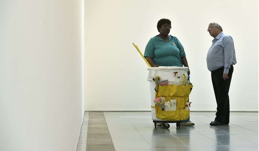A man looking at a sculpture called ‘Queenie II’ by late US artist Duane Hanson at the Serpentine Sackler Gallery in London in 2015. Photo: Reuters