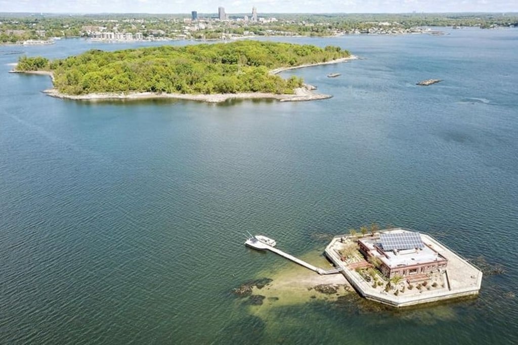 The home on Columbia Island, roughly an acre in size, and the four-acre Pea Island, which are situated off the coast of New Rochelle, in the state of New York. The home on Columbia Island, roughly an acre in size, and the four-acre Pea Island, which are situated off the coast of New Rochelle, in the state of New York.