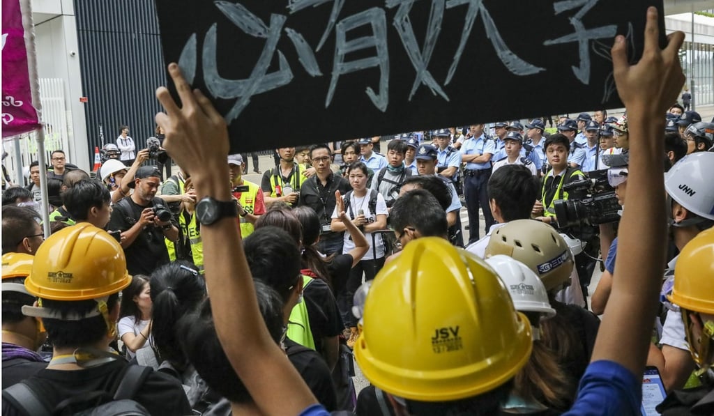 On Monday morning, police took a low-key approach, appealing to protesters to leave the streets. Photo: K.Y. Cheng