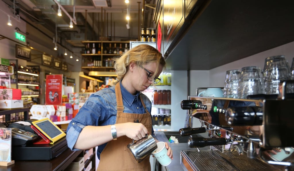 Barista Zoe Dixon pours a coffee at Feather & Bone in Happy Valley. Photo: Xiaomei Chen