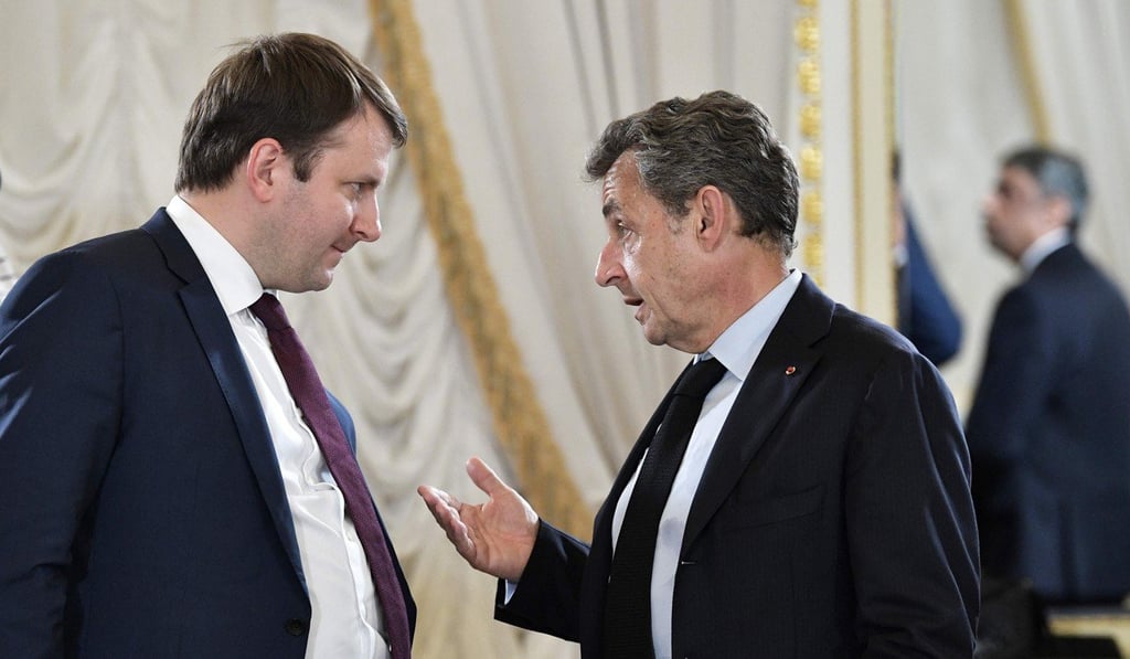 Former French President Nicolas Sarkozy (right) speaks with Russian Economy Minister Maxim Oreshkin. Photo: AFP Former French President Nicolas Sarkozy (right) speaks with Russian Economy Minister Maxim Oreshkin. Photo: AFP