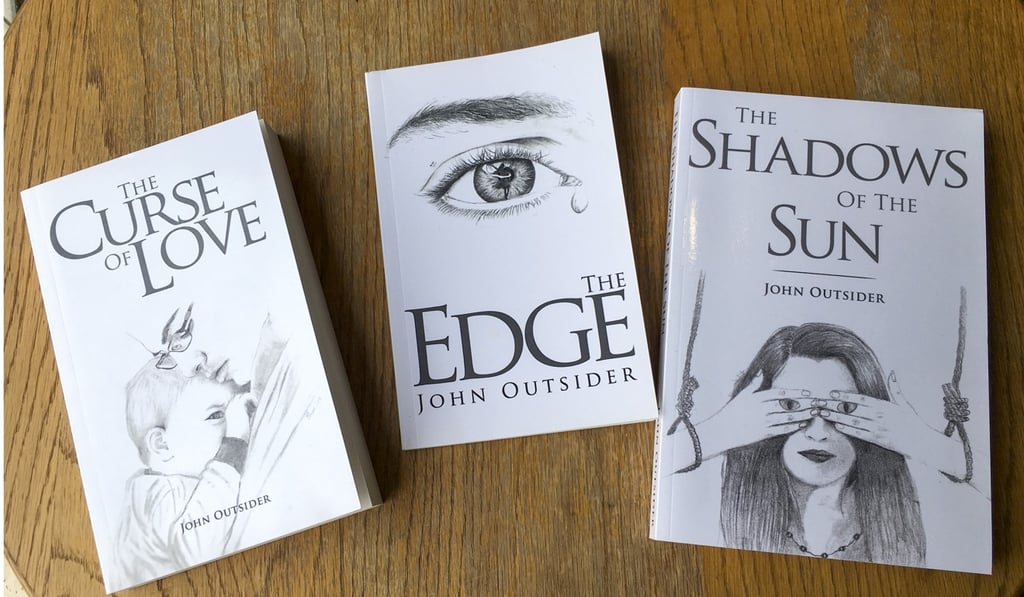 John Outsider has self-published three books based on his experiences and observations of Hong Kong society. Photo: Fiona Sun