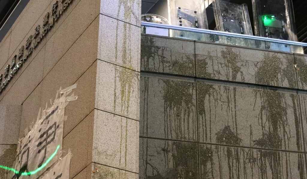 Egg marks on the wall of the police headquarters after a 15-hour stand-off with protesters. photo: Felix Wong Egg marks on the wall of the police headquarters after a 15-hour stand-off with protesters. photo: Felix Wong