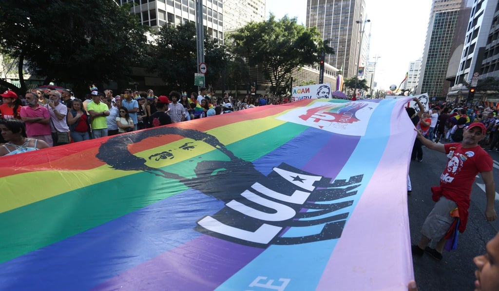 Participants hold a banner during the LGBT Gay Pride parade at Paulista Avenue. Photo: DPA