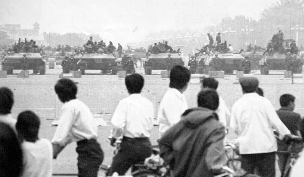 Curious Beijing residents gather to look at members of the armed forces in Tiananmen Square, Beijing, on June 7, 1989. Photo: AP
