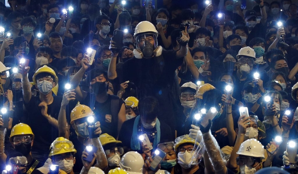 Youth protesters gather in front of police headquarters in Hong Kong on June 21. Photo: AP