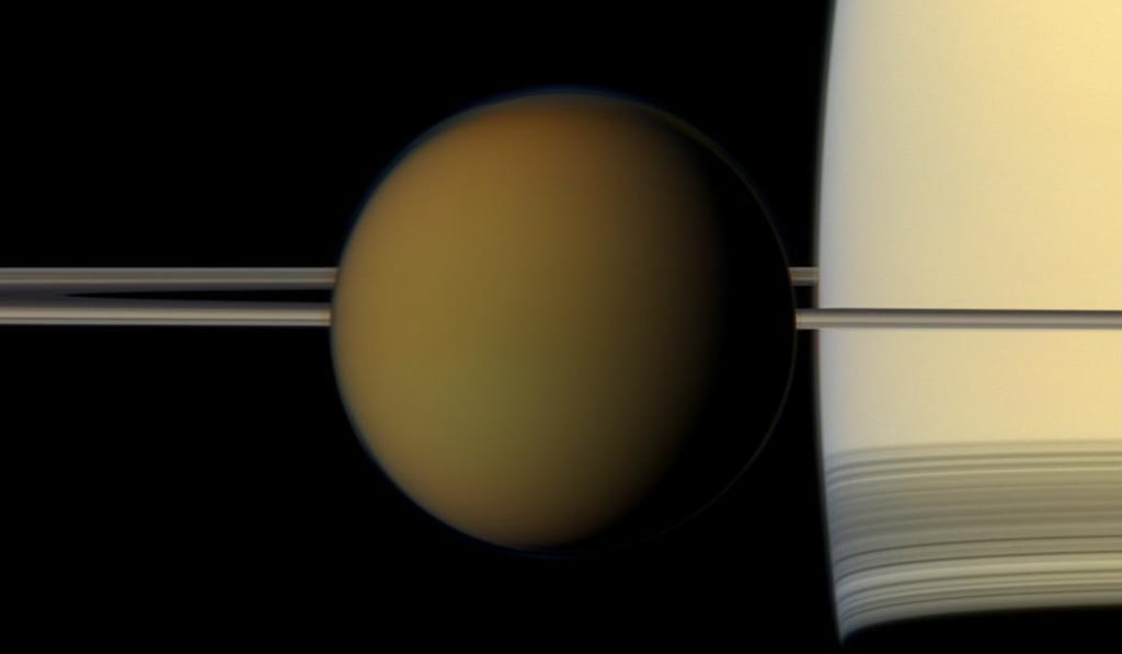 Titan passing in front of Saturn and its rings. Photo: AP/Nasa