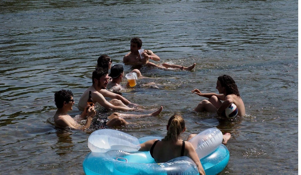 People drink and bathe in the Loire River in France. Photo: AFP People drink and bathe in the Loire River in France. Photo: AFP