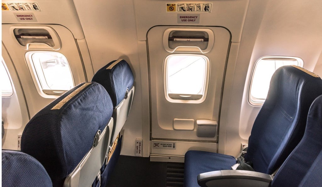 A man sparked alarm after opening an emergency exit on a flight from Bangkok to Wuhan. Photo: Shutterstock A man sparked alarm after opening an emergency exit on a flight from Bangkok to Wuhan. Photo: Shutterstock