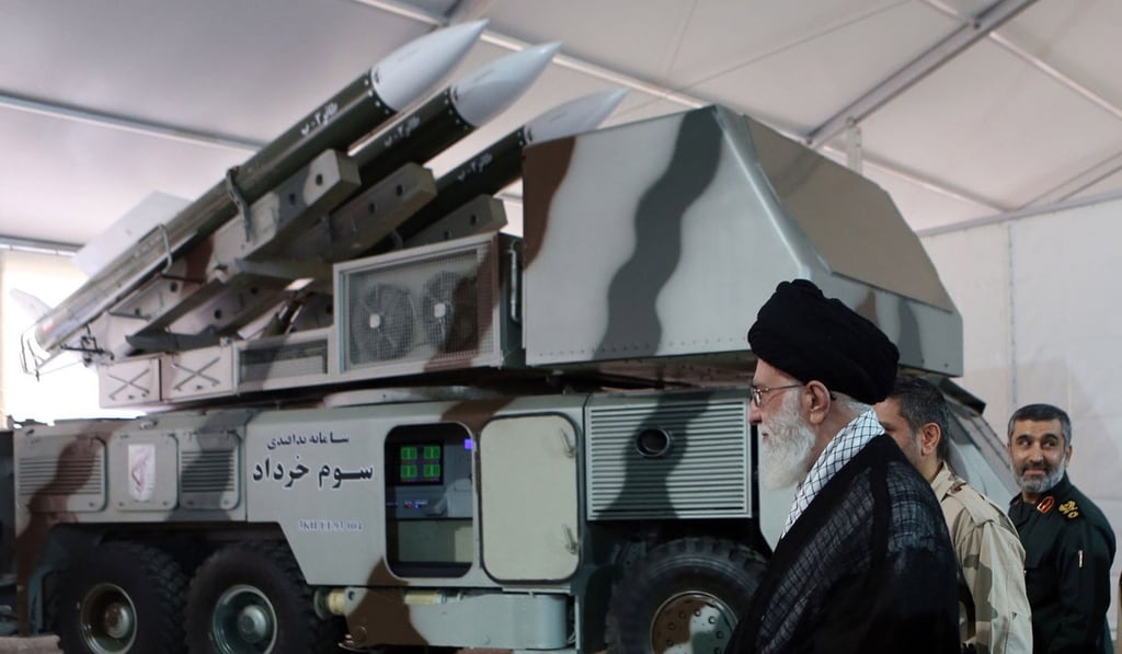 Iranian Supreme Leader Ali Khamenei next to a Khordad-3 missile system in Tehran. Photo: EPA