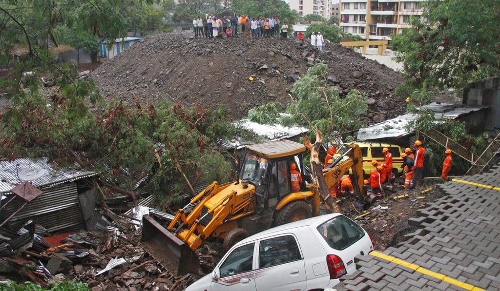 Rescuers look for survivors in the debris of the collapsed wall in Pune. Photo: Reuters