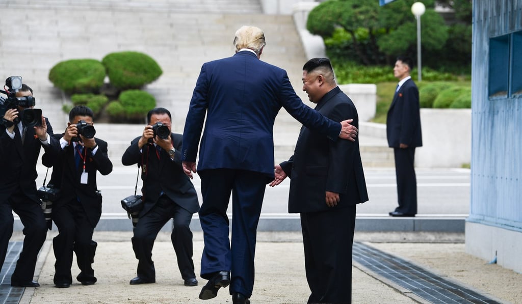 US President Donald Trump stepping into North Korea on Sunday. Photo: AFP US President Donald Trump stepping into North Korea on Sunday. Photo: AFP