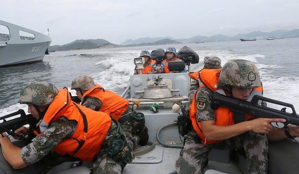 Soldiers are seen with automatic rifles during the exercise in Hong Kong. Photo: Weibo