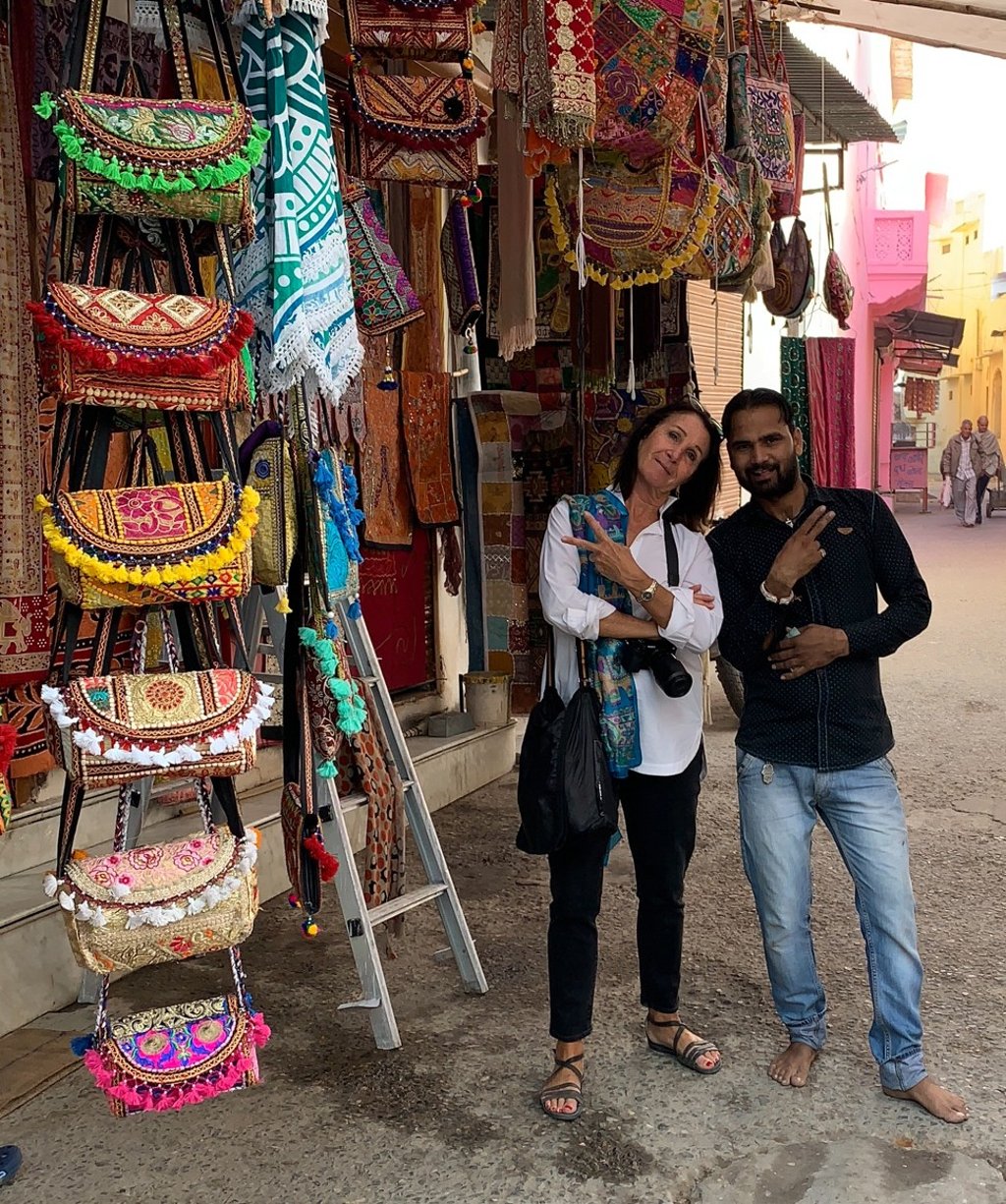 A tourist with a local vendor. Photo: courtesy of Tours n Detours