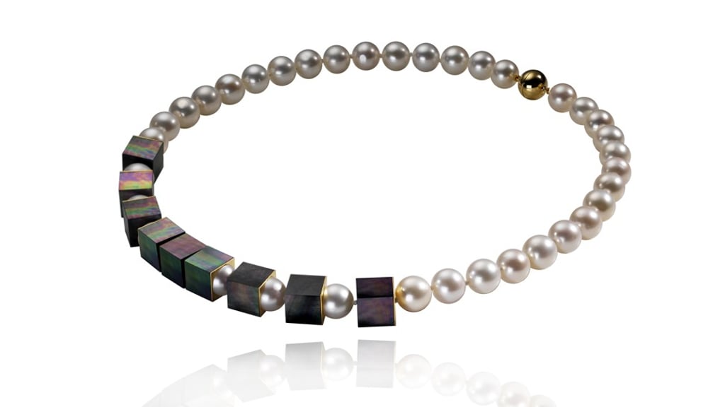 A necklace with 10-millimetre (0.4-inch) Peacock mother-of-pearl and freshwater pearls and an 18-carat yellow gold clasp from Melanie Georgacopoulos’ Cube collection