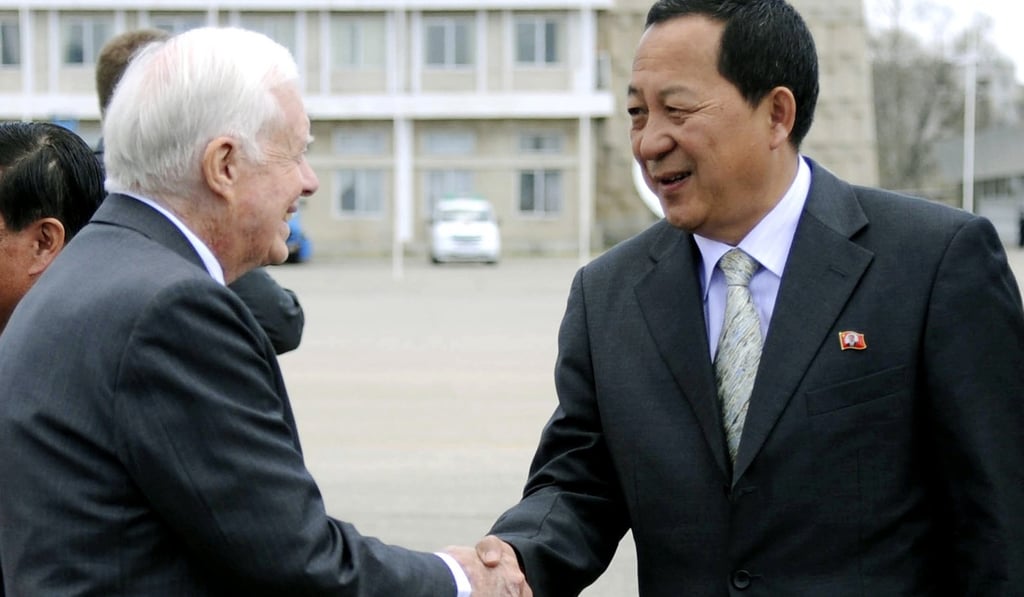 Former US president Jimmy Carter (left) bids goodbye to Ri Yong Ho, North Korea's vice foreign minister, at Pyongyang airport during denuclearisation talks in April 2011. Photo: AP