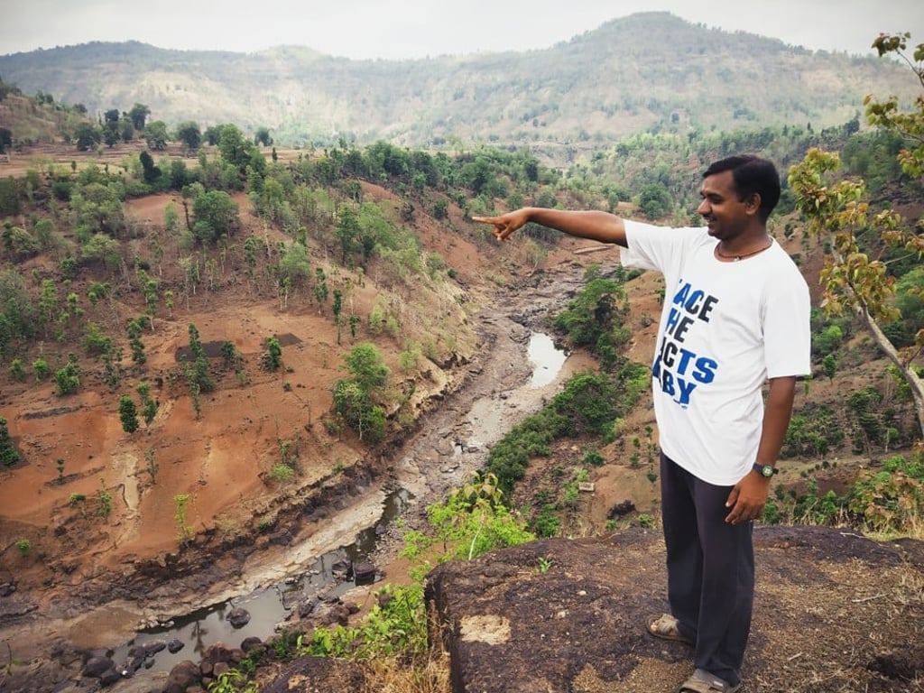 Farmer Narayan Mahale can see the river, now drying, flowing past through the year. But that water often does not reach him. Photo: Kunal Purohit
