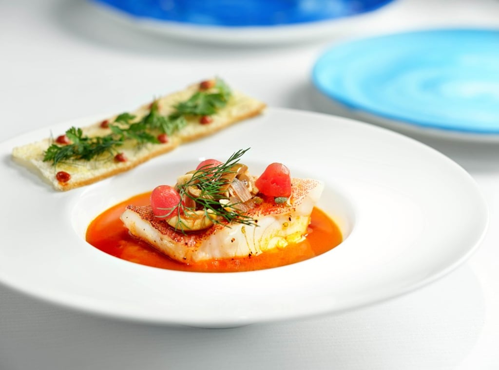 One of chef Angelo’s delicious seafood dishes at the Tosca di Angelo is seared line-caught sea bass served with broccoli rabe and datterino tomato confit. One of chef Angelo’s delicious seafood dishes at the Tosca di Angelo is seared line-caught sea bass served with broccoli rabe and datterino tomato confit.