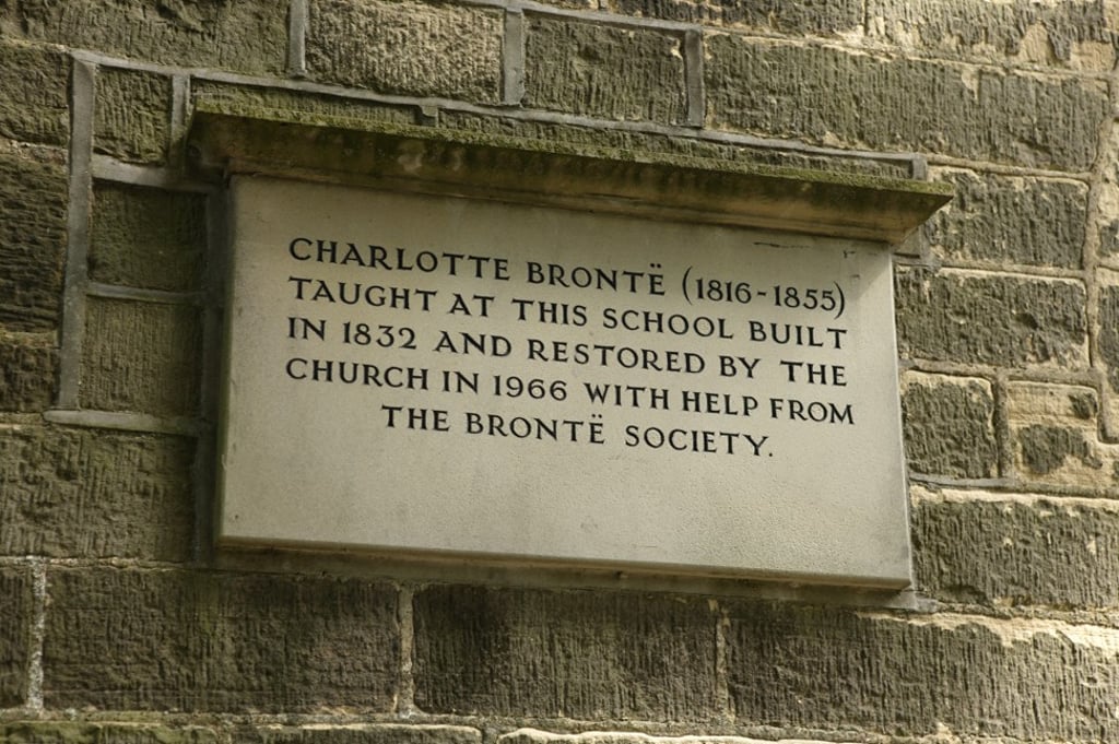 A stone plaque commemorates Charlotte Brontë in Haworth Village, in Yorkshire, England. Photo: Daniel Heighton A stone plaque commemorates Charlotte Brontë in Haworth Village, in Yorkshire, England. Photo: Daniel Heighton