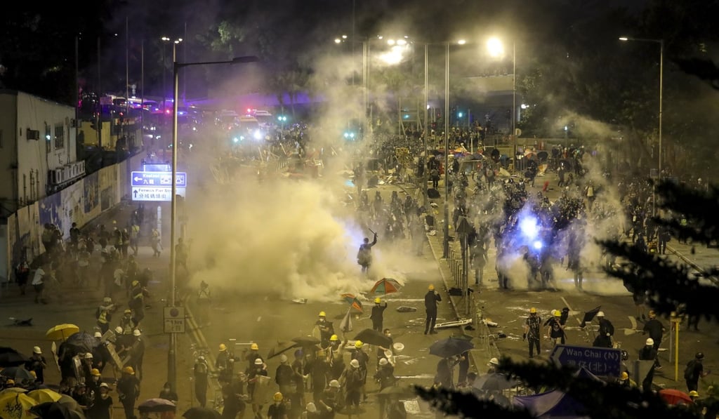 Police fire tear gas in the early hours of July 2 to disperse protesters. Photo: Sam Tsang