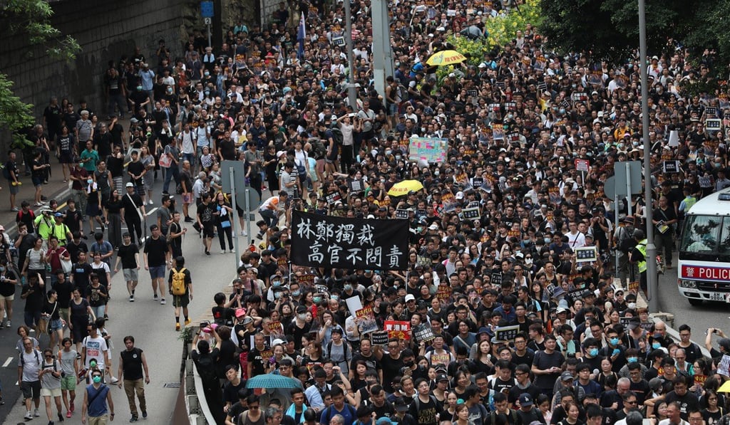 The higher-than-expected turnout leads to some crowds spilling over into nearby lanes as the procession lumbers on. Photo: Sam Tsang