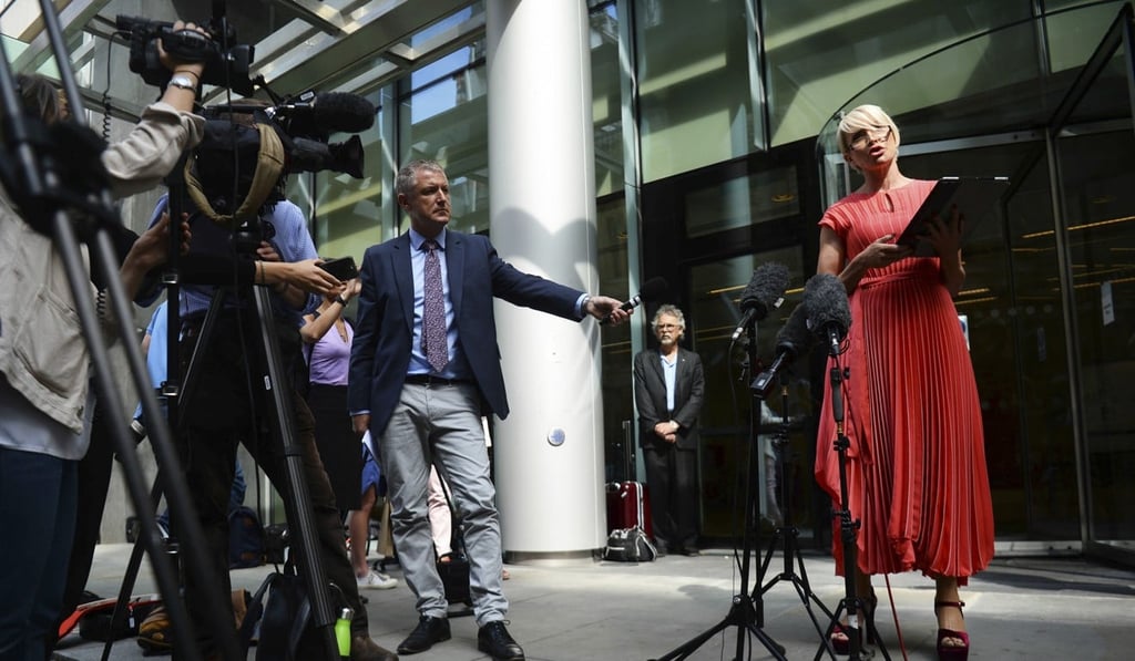 Mills speaks to the media outside court in London on July 8. Photo: AP