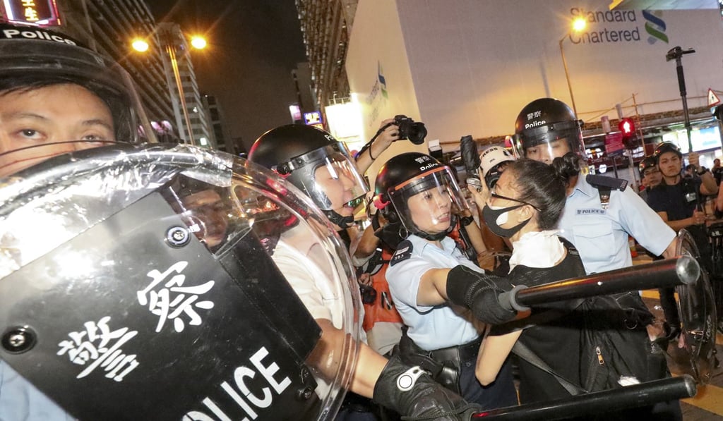 Riot police attempt to clear Nathan Road during the protest in Mong Kok. Photo: Dickson Lee