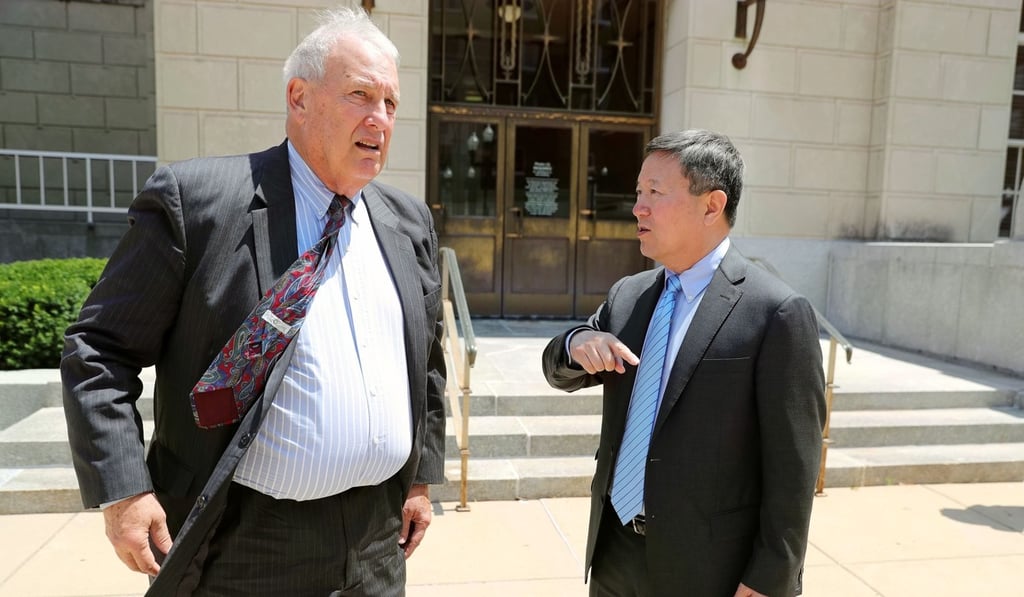 Wang Zhidong, adviser to Yingying’s family, talks with lawyer Steve Beckett on Monday. Photo: Xinhua