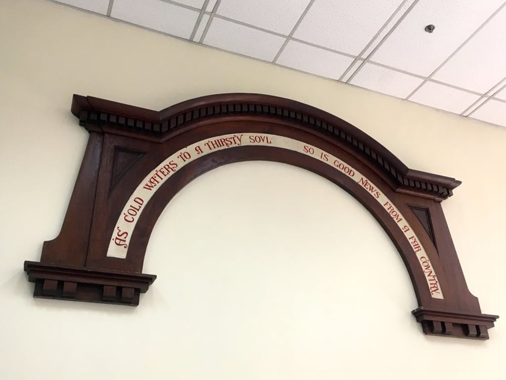 The sign inside Hong Kong’s General post office, that reads: “As cold waters to a thirsty soul, so is good news from a far country”. Photo: Adam Nebbs