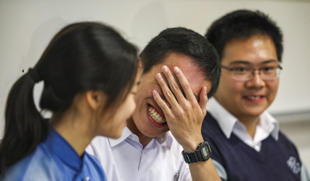 Anson Kam (centre), pictured alongside other high achievers Winnie Chow (left) and Ho Tsi-lok (right), is overjoyed at coming in the top 0.01% in Hong Kong’s DSE exams. Photo: Nora Tam
