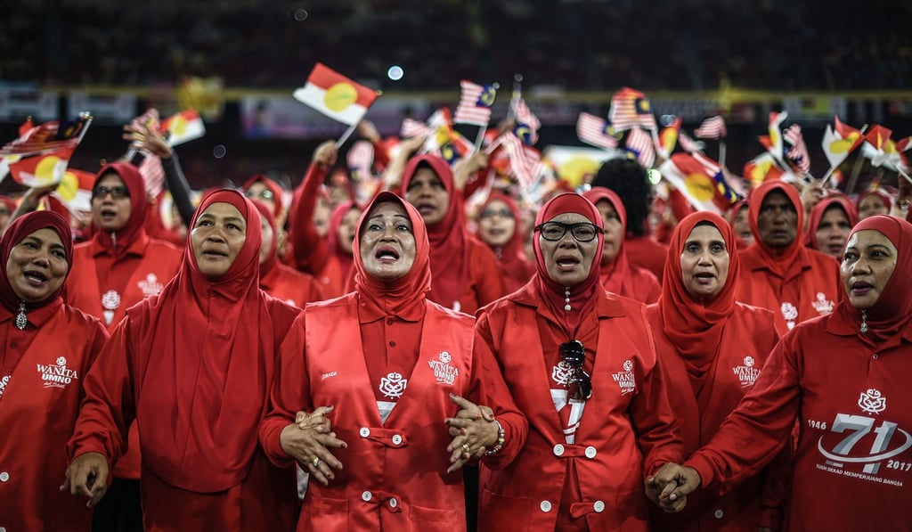 Supporters of the United Malays National Organisation attend an anniversary celebration. Photo: AFP