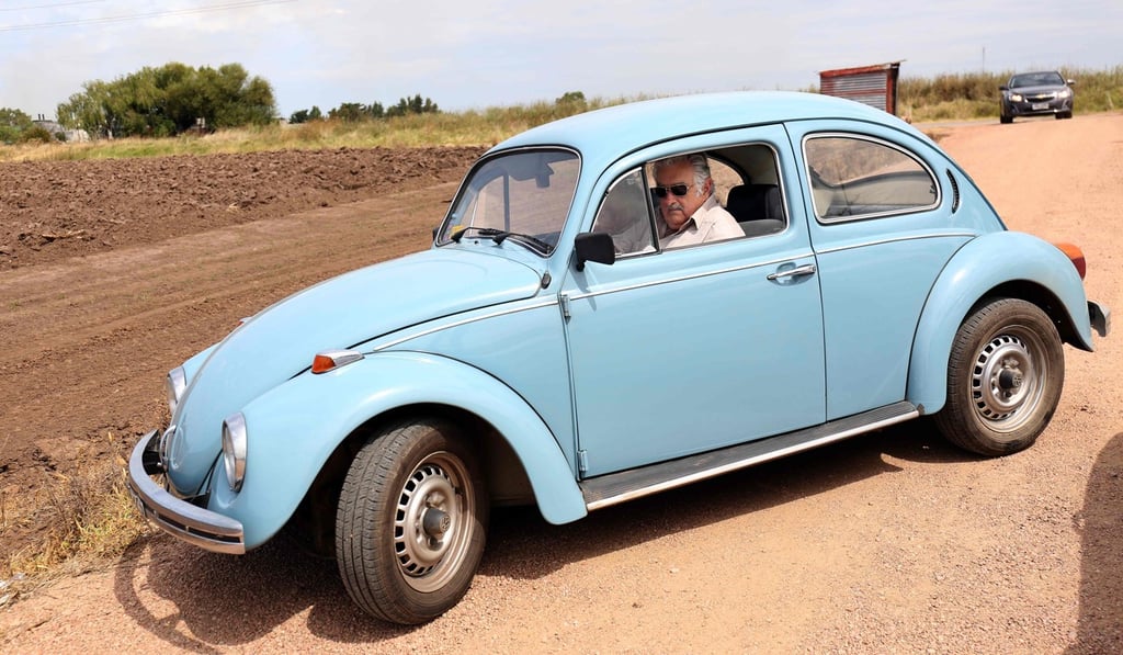 Uruguay's former president Jose Mujica drives his Volkswagen Beetle near his house in March 2015. Photo: AFP
