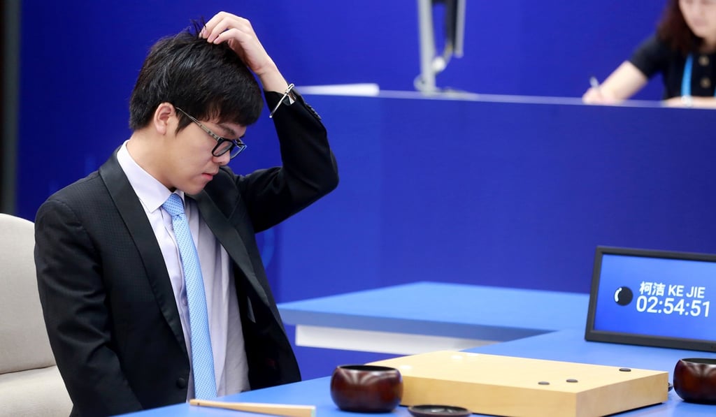 China's 19-year-old Go player Ke Jie reacts during the first match against Google's artificial intelligence programme AlphaGo in Wuzhen. Photo: AFP