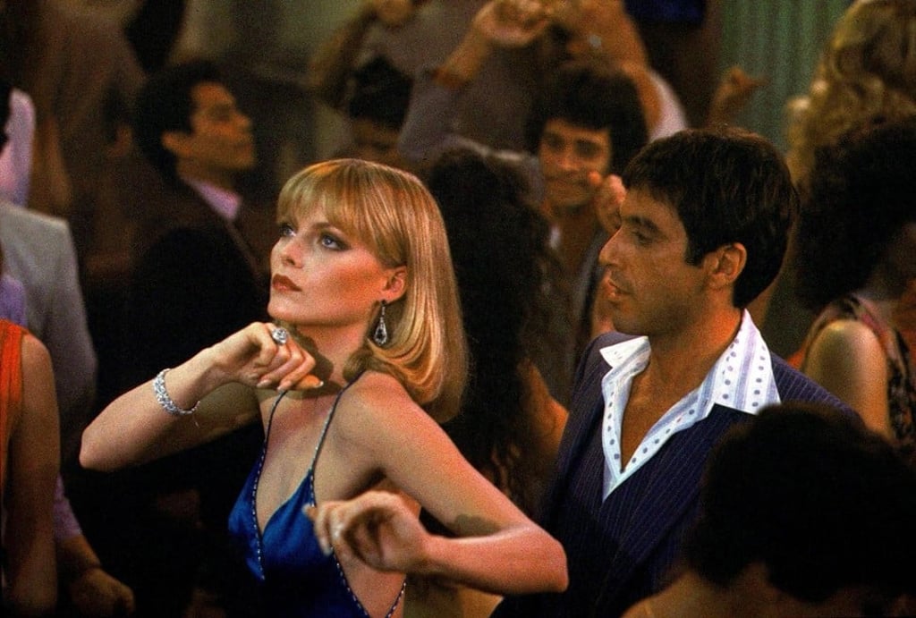 Michelle Pfeiffer with Pacino in Scarface (1983). Michelle Pfeiffer with Pacino in Scarface (1983).