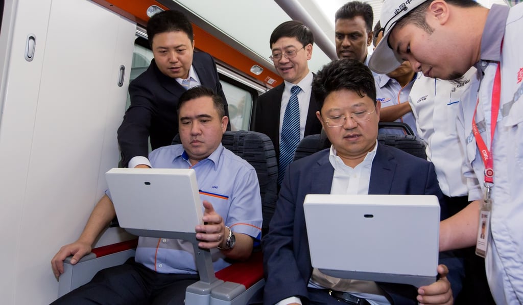 Malaysian Transport Minister Anthony Loke (left, front) with Chinese ambassador to Malaysia Bai Tian (centre, front). Photo: Xinhua