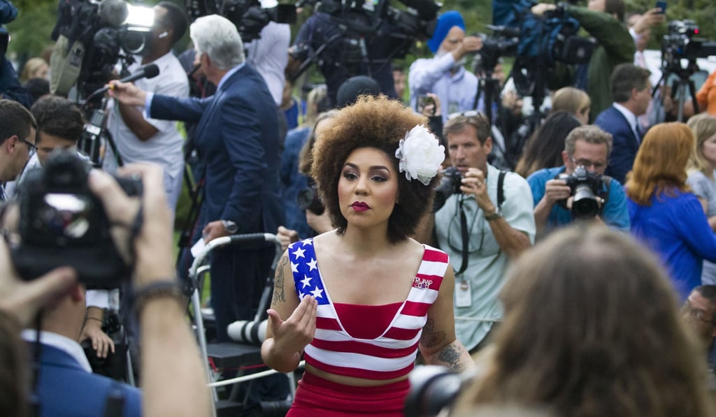 Singer-songwriter, Joy Villa speaks with a journalist after President Donald Trump spoke about the 2020 census in the Rose Garden of the White House. Photo: AP