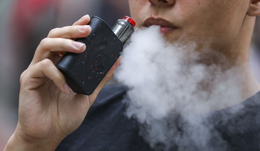 A man smokes an e-cigarette in Hong Kong in October. Photo: Nora Tam