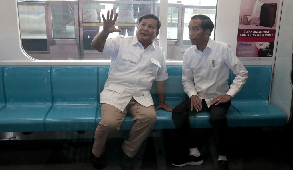 Prabowo Subianto and Indonesian President Joko Widodo take a subway ride in Jakarta. Photo: AP