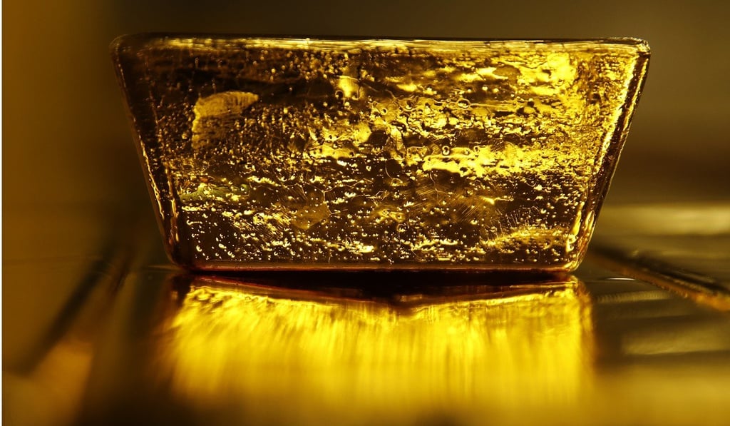 A 12.5 kilogram gold bullion bar sits in Lugano, Switzerland. Gold's haven qualities have come back in focus this year. Photo: Bloomberg