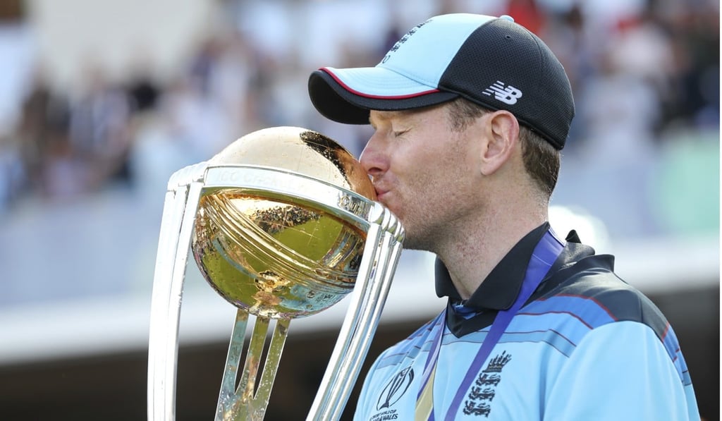 England skipper Eoin Morgan kisses the trophy. Photo: AP