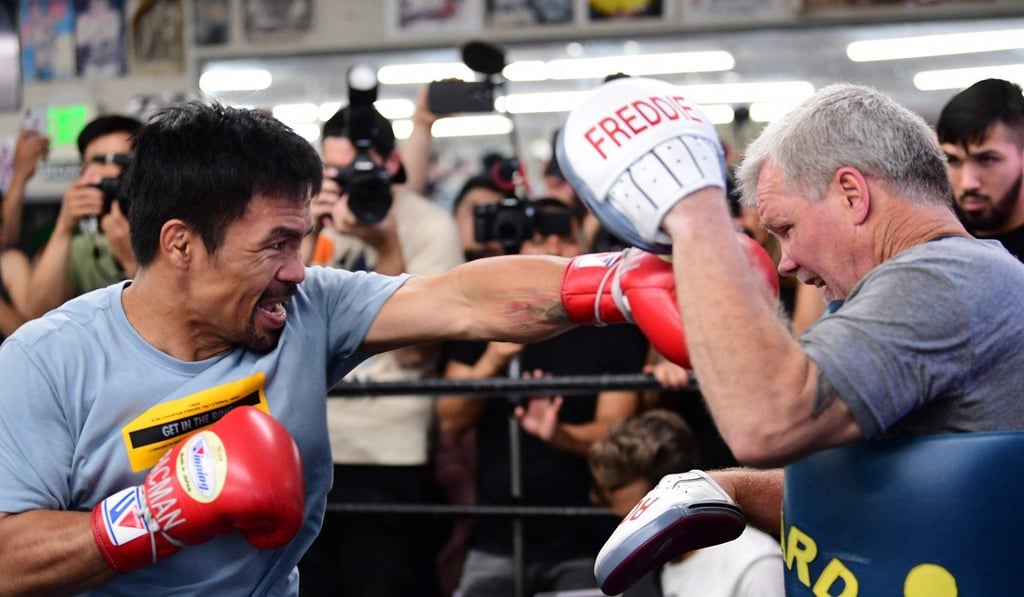 Manny Pacquiao spars with coach Freddy Roach in Hollywood, California. Photo: AFP