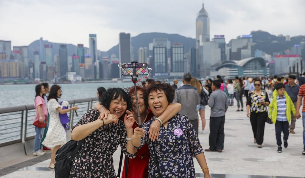 Mainland Chinese tourists visit the Avenue of Stars at Victoria Harbour in Tsim Sha Tsui. Photo: Sam Tsang