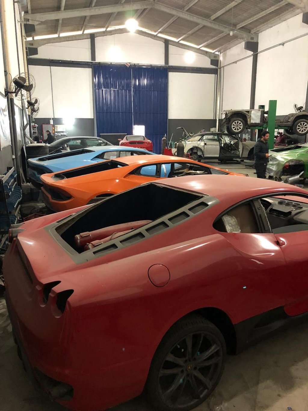 The clandestine workshop was run by a father and son who assembled fake Ferraris and Lamborghinis to order. Photo: AP The clandestine workshop was run by a father and son who assembled fake Ferraris and Lamborghinis to order. Photo: AP
