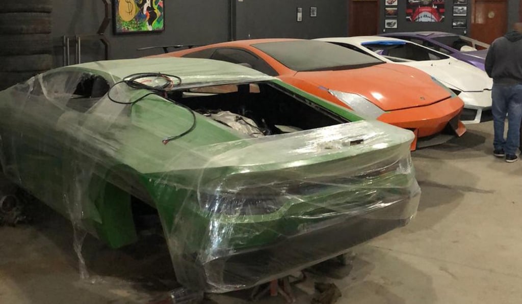 Car moulds of luxury car replicas at the workshop. Photo: AFP Car moulds of luxury car replicas at the workshop. Photo: AFP