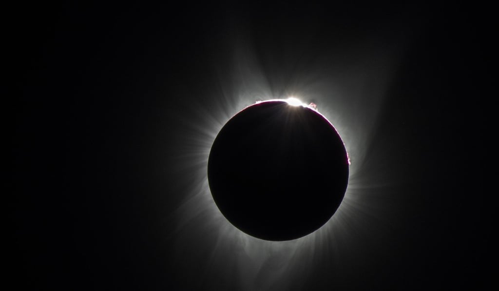 Solar flares, the solar corona, and the beginning of the diamond ring effect are seen during a total solar eclipse in August 2017. Photo: Shutterstock