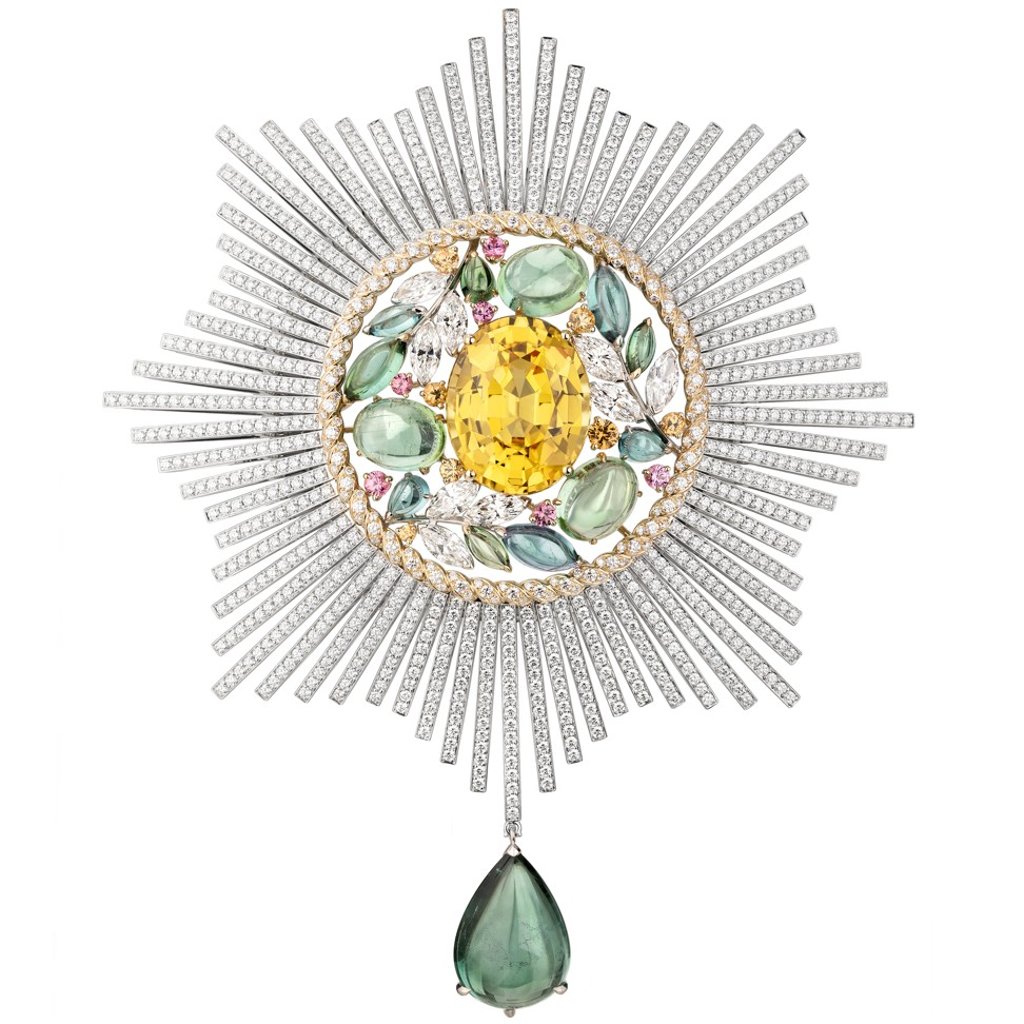 Chanel's lavish Ble Maria brooch, which includes white and yellow gold, Mandarin garnets, tourmaline and diamonds